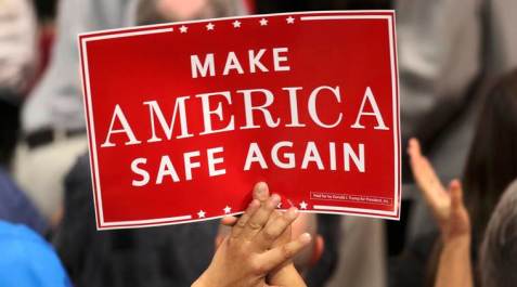 A delegate holds a sign during speeches at the Republican National Convention in Cleveland, Ohio